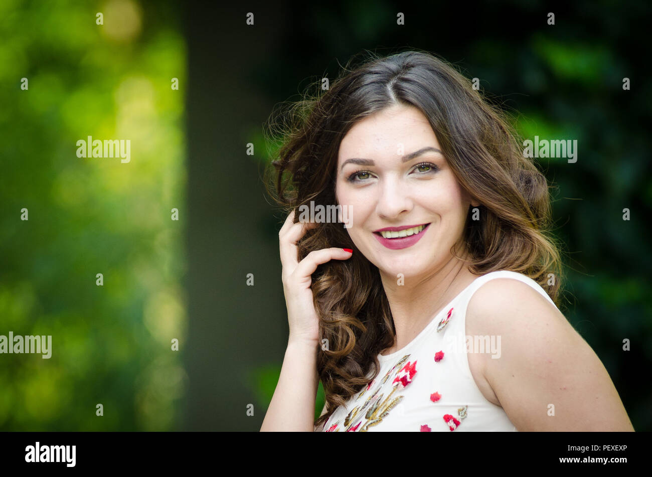 Portrait of a beautiful young girl on nature Stock Photo - Alamy