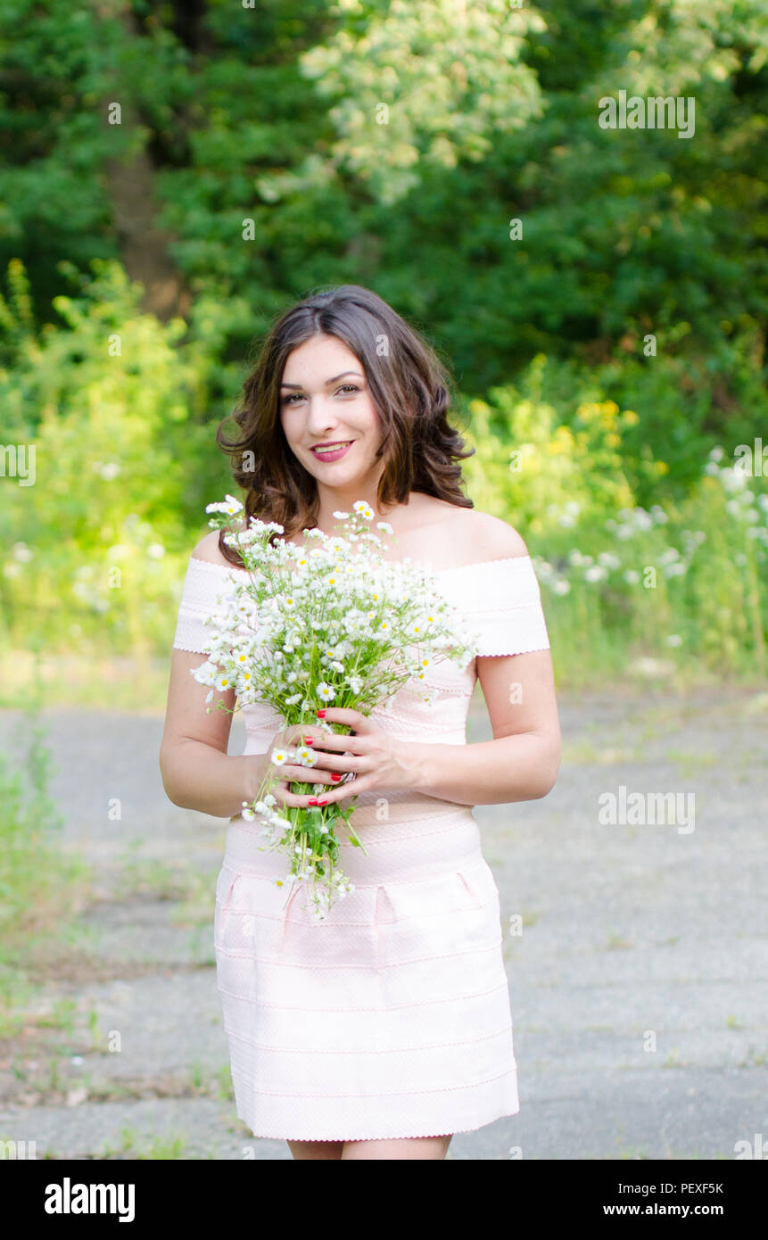 Portrait of a beautiful young girl on nature Stock Photo - Alamy