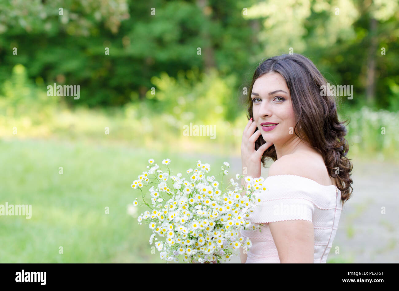 Portrait of a beautiful young girl on nature Stock Photo - Alamy