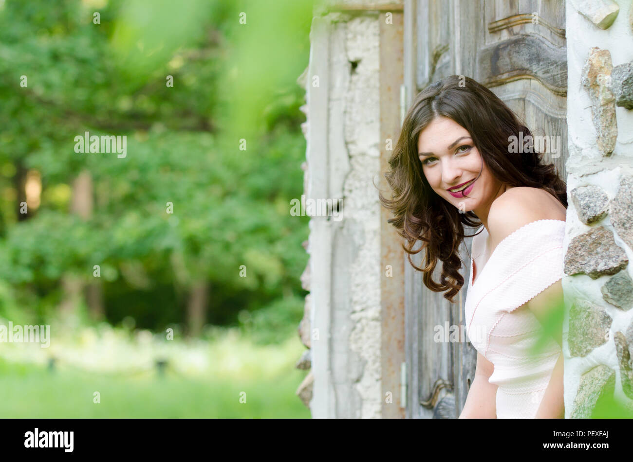 Portrait of a beautiful young girl on nature Stock Photo - Alamy