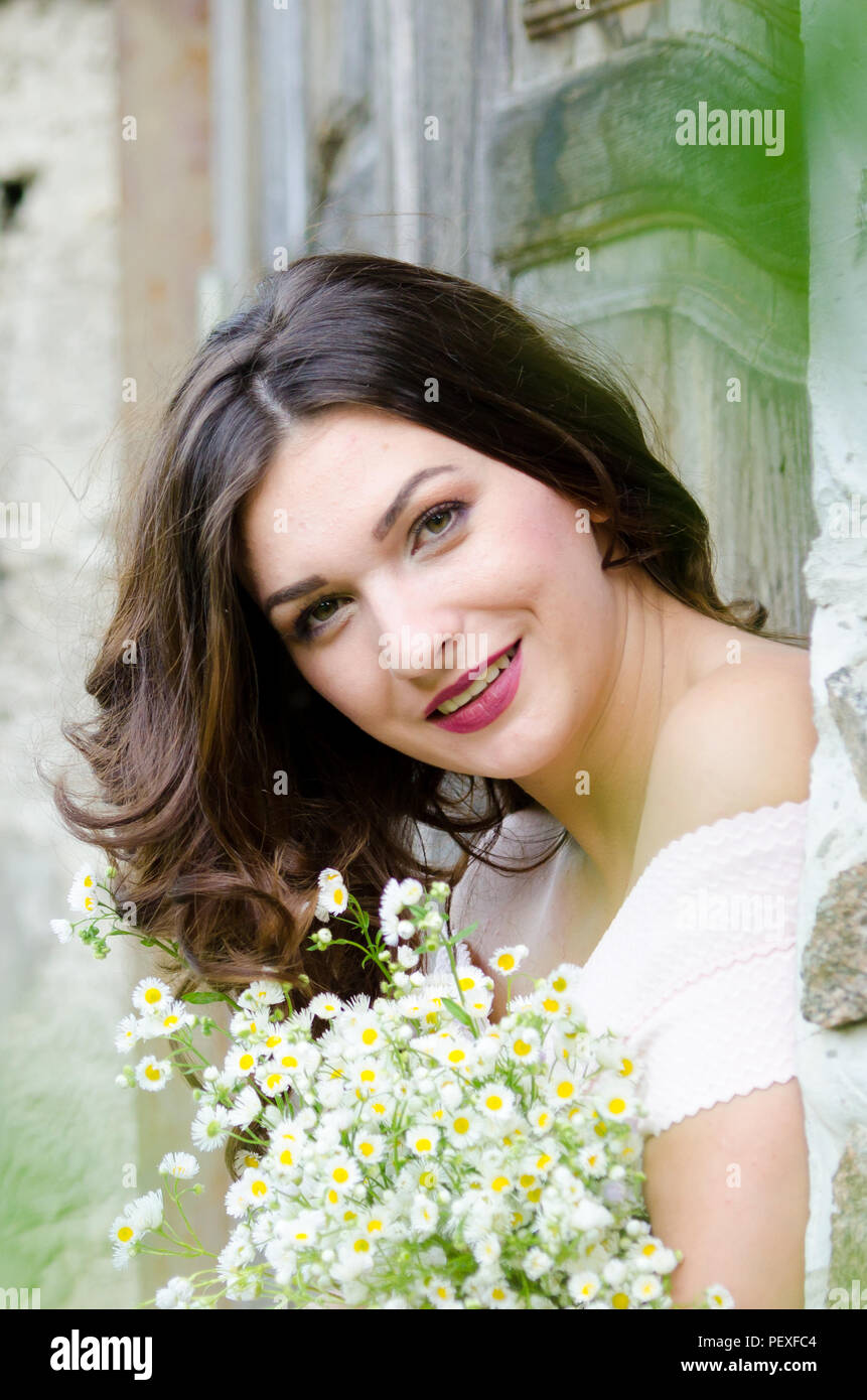 Portrait of a beautiful young girl on nature Stock Photo - Alamy