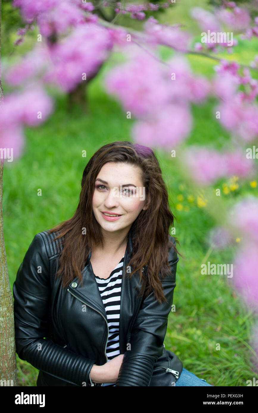 Portrait of a beautiful young girl on nature Stock Photo - Alamy