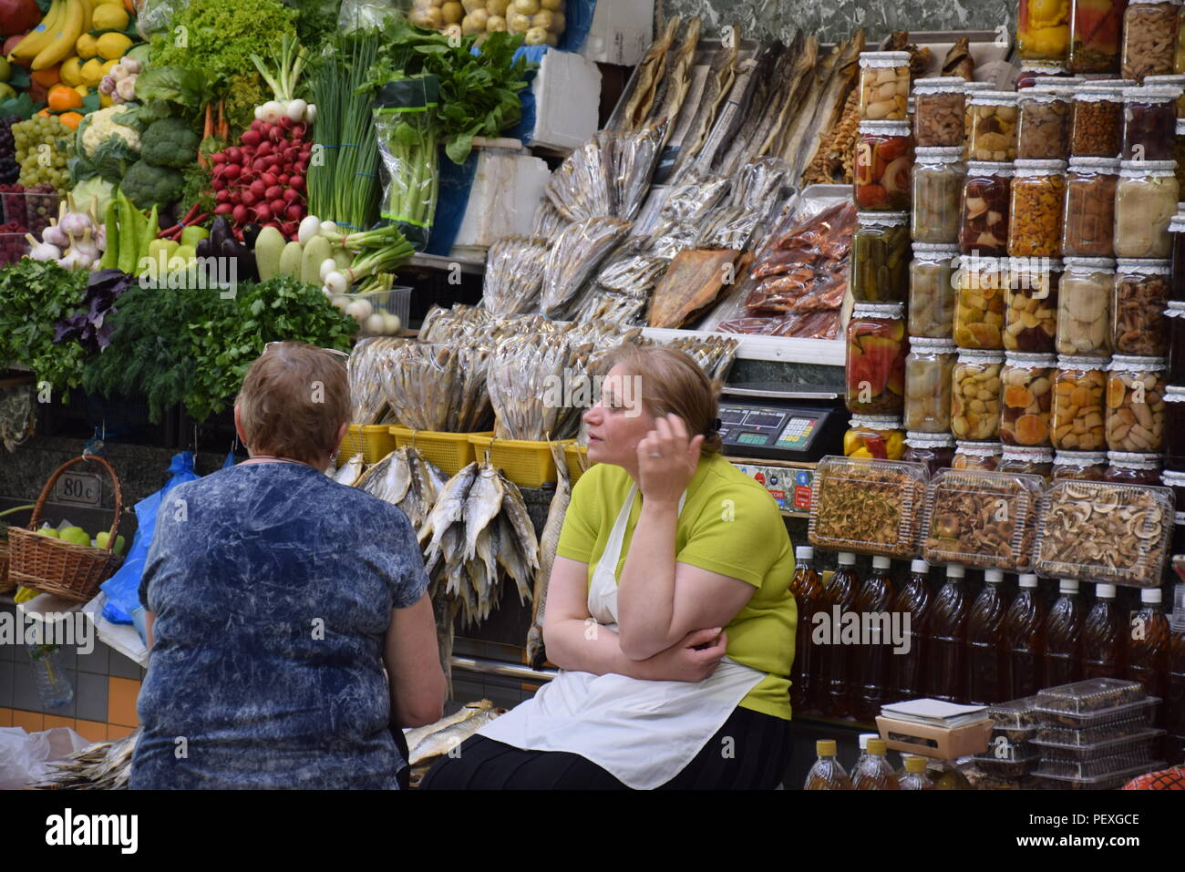 Two russian women in front of her food stall in a food market in Moscow, Russia Stock Photo