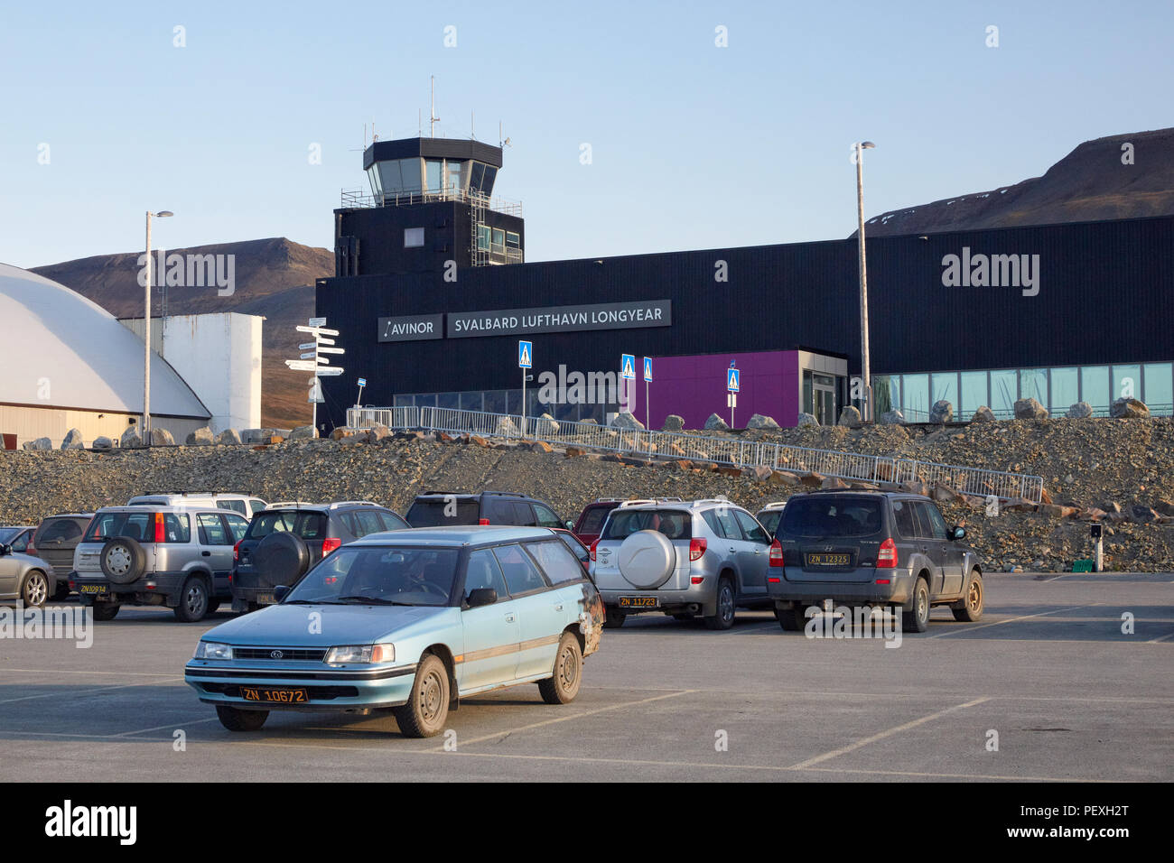 Svalbard Longyearbyen airport, Svalbard Lufthavn Longyer with parking lot in front of it Stock Photo