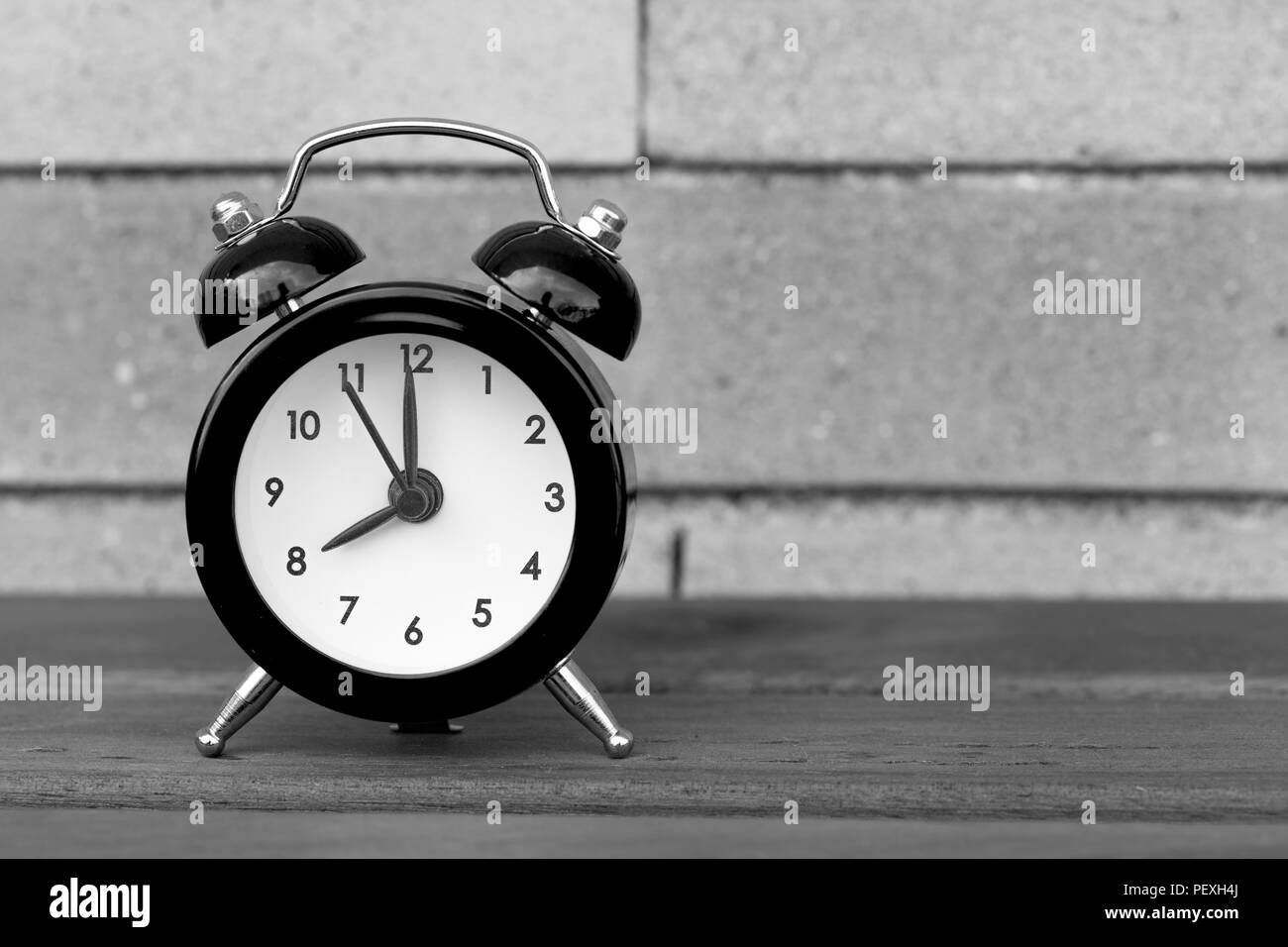 Tiny Purple Alarm Clock wall background Stock Photo Alamy