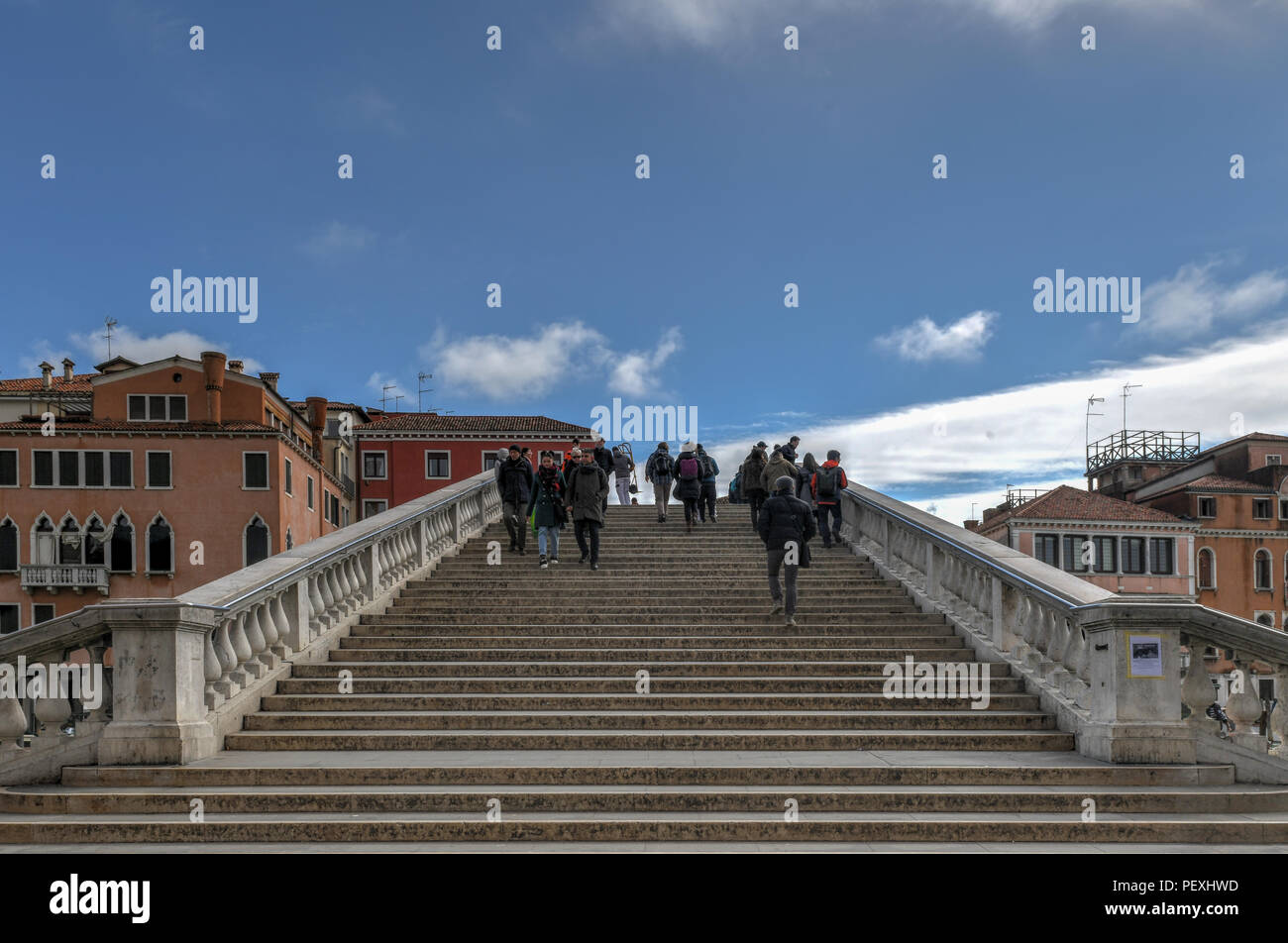 Venice, Italy - March 20, 2018: Ponte Degli Scalzi Bridge Grand Canal Tourists Boats Venice Italy. Bridge was built in the 1930s. Stock Photo