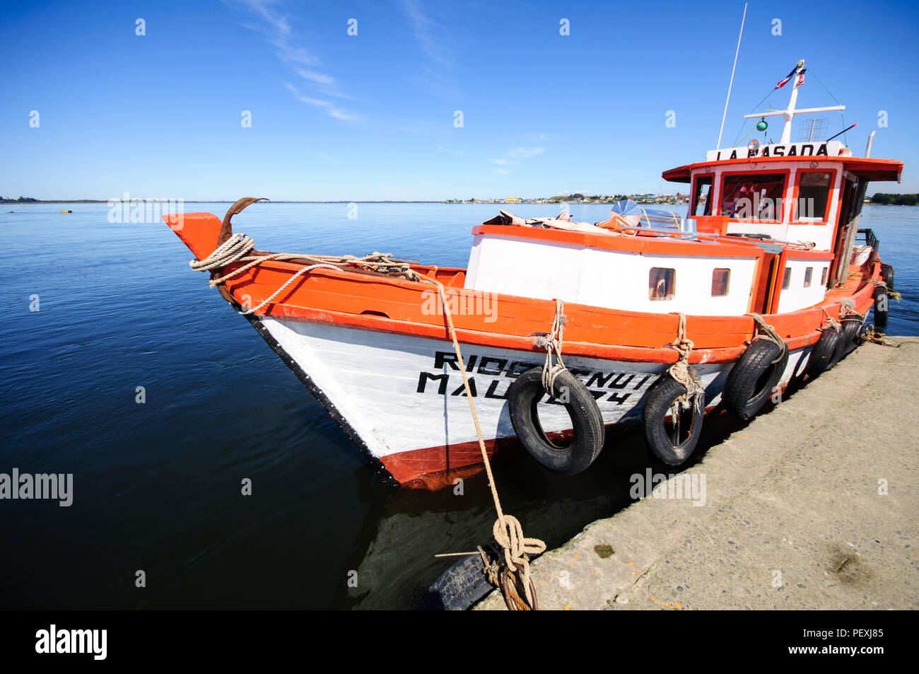 A traditional boat is moored at La Pasada, opposite Maullin town on the estuary of the Maullin River in the Los Lagos region of Chile. Stock Photo
