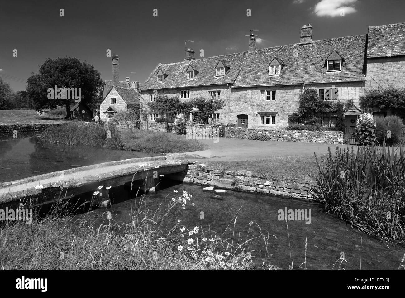 Summer view over Cottages and the River Eye, Lower Slaughter village