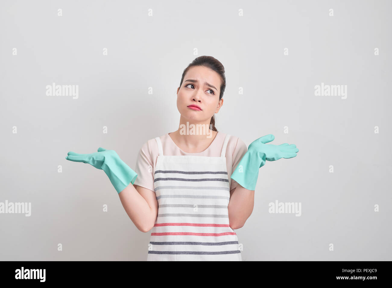 pretty elegant housewife cleaning house long time feeling tired isolated on white background. Stock Photo