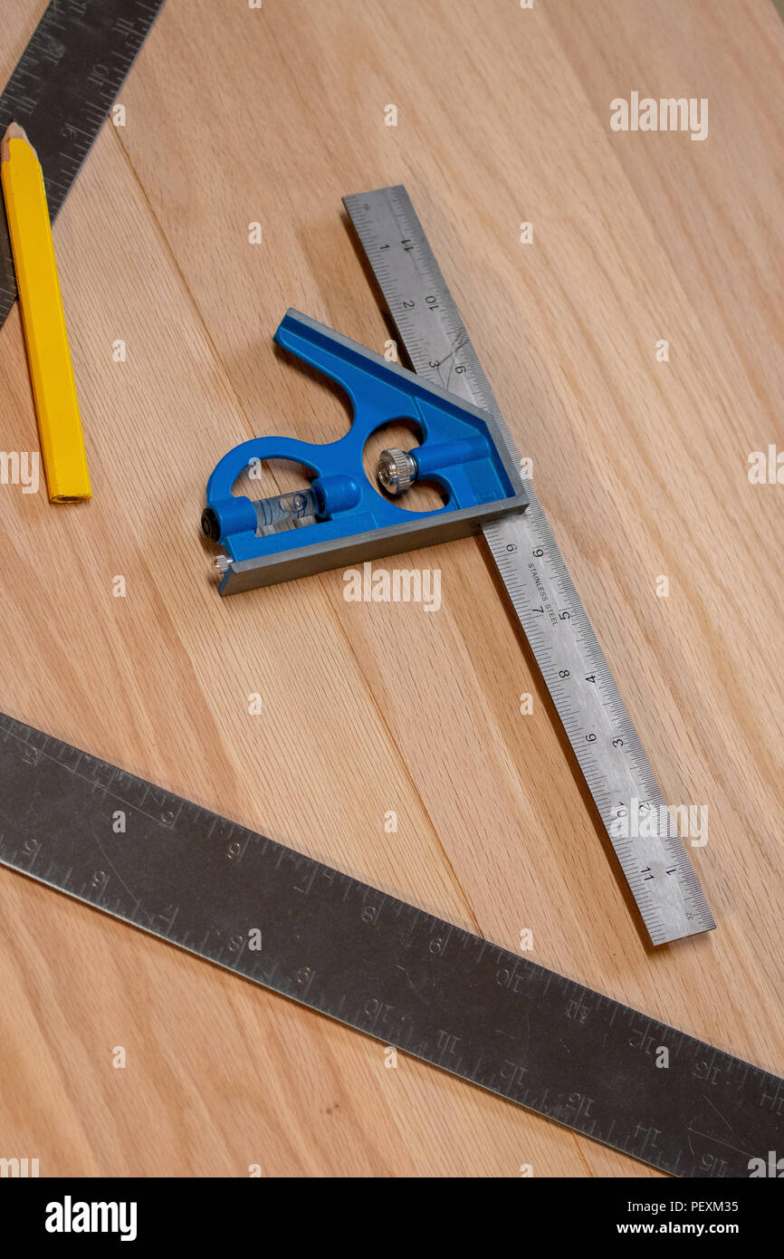A Square And Other Carpentry Tools Rest On An Oak Workbench Ready