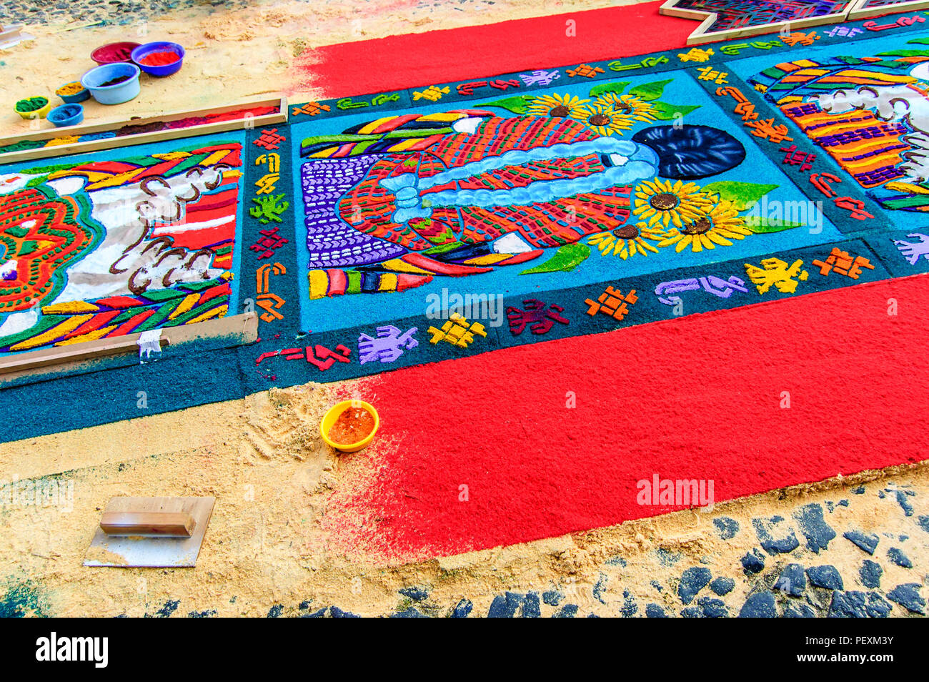 Antigua, Guatemala -  April 1, 2012: Making Palm Sunday procession carpet in UNESCO World Heritage Site with famous Holy Week celebrations. Stock Photo