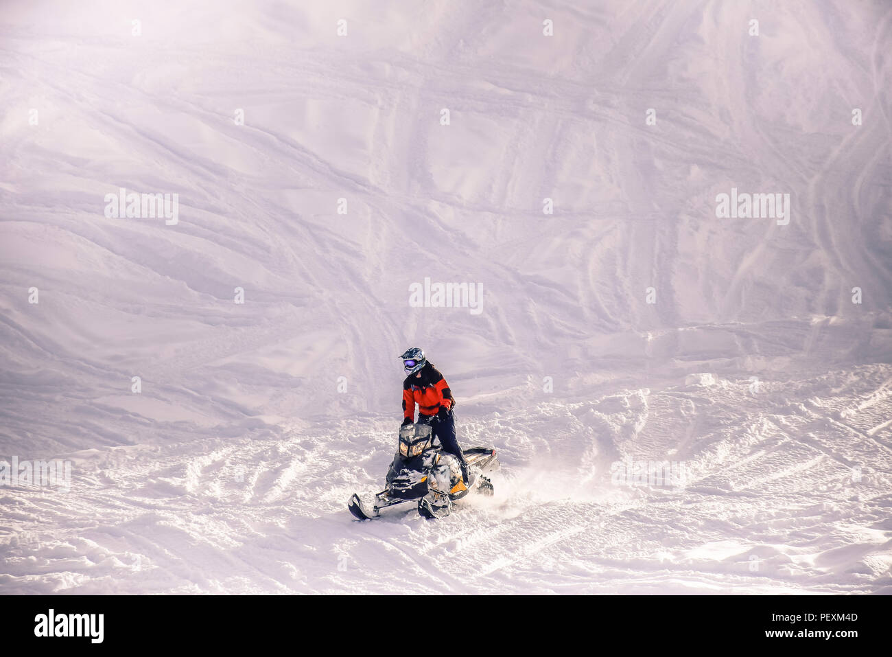 Man riding snowmobile in Callaghan Valley, Whistler, British Columbia, Canada Stock Photo