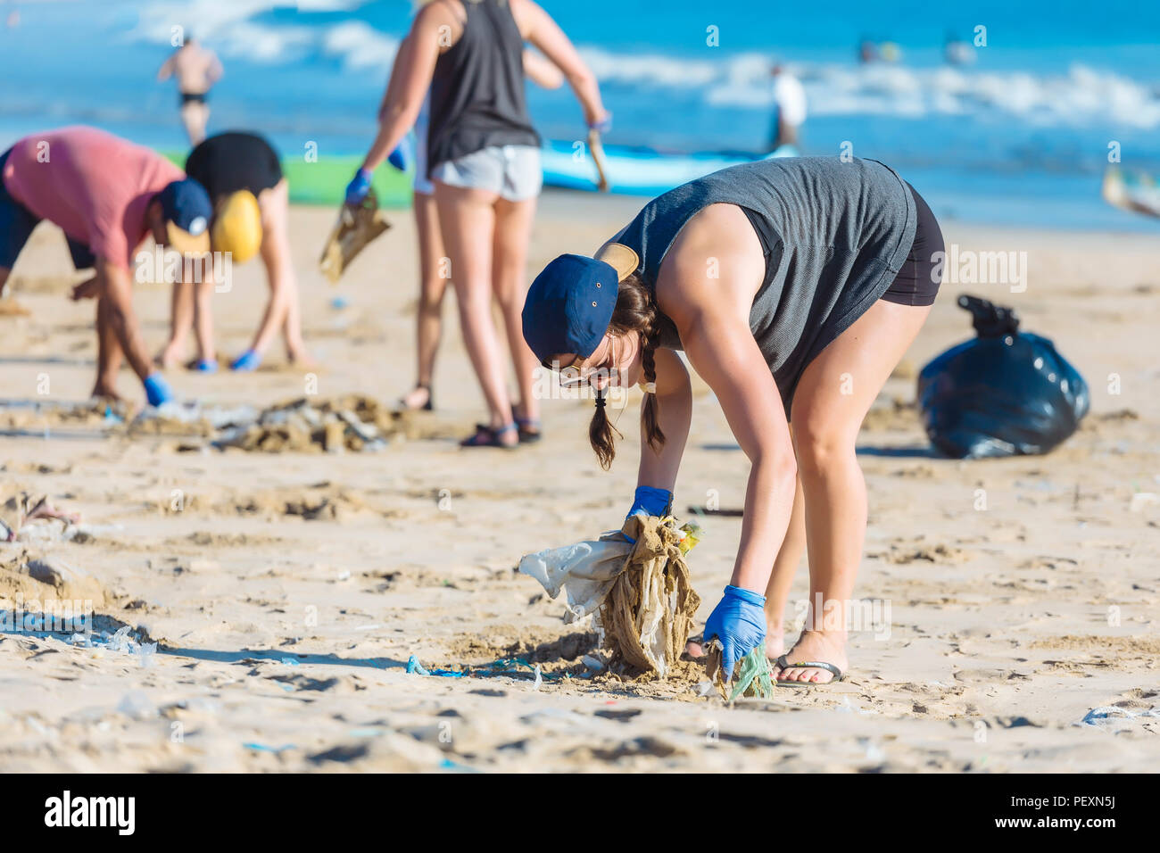 Picking up litter beach hi-res stock photography and images - Alamy
