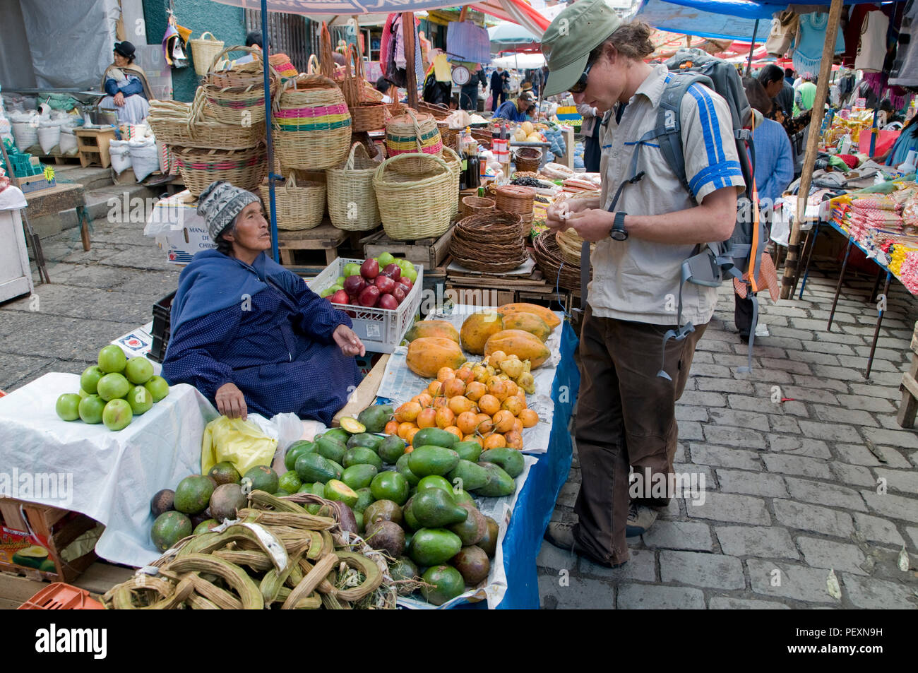 Man buying fruit at street market, La Paz, Bolivia Stock Photo