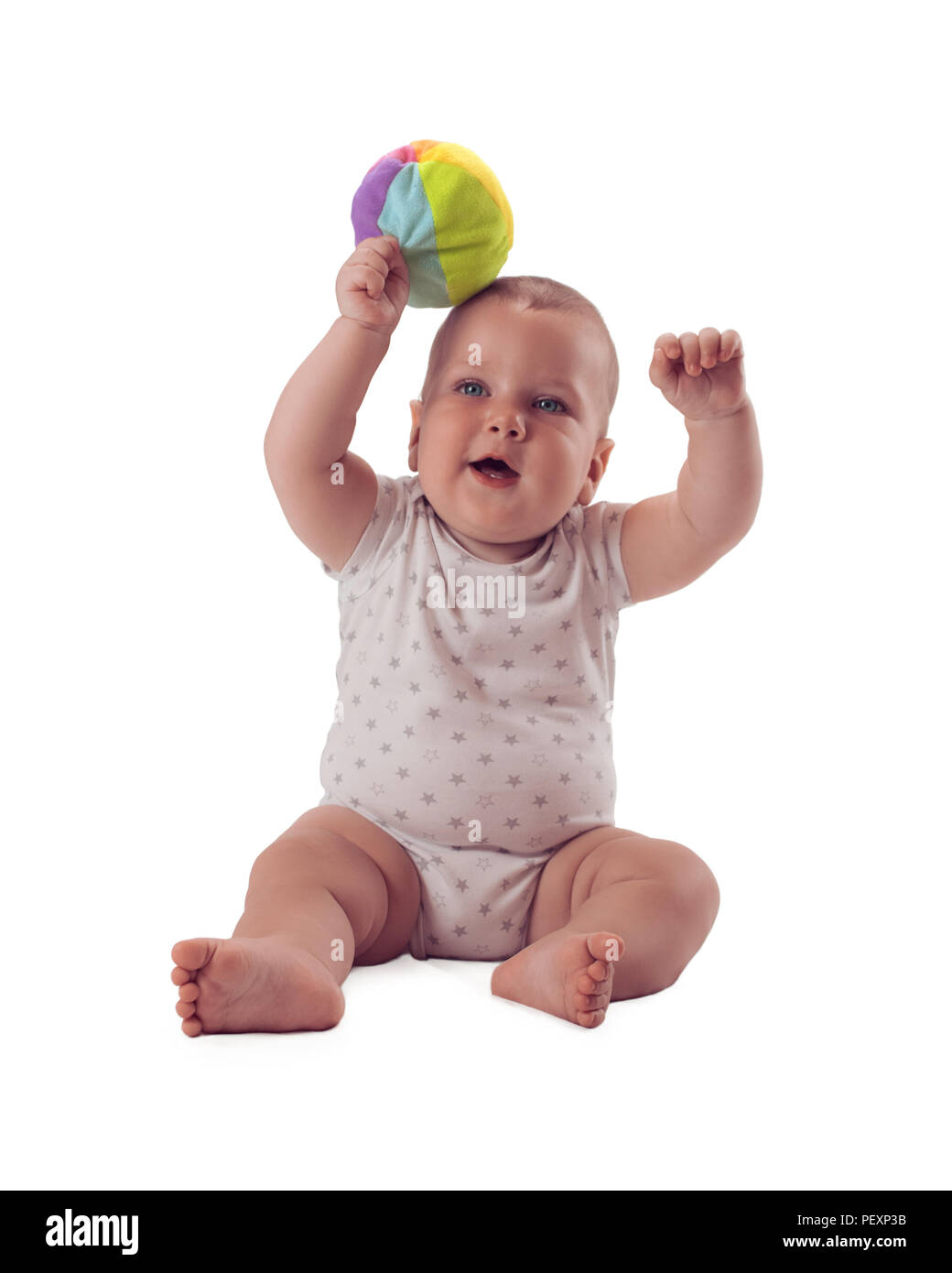 Adorable baby raised the ball above his head. Isolated on white background Stock Photo