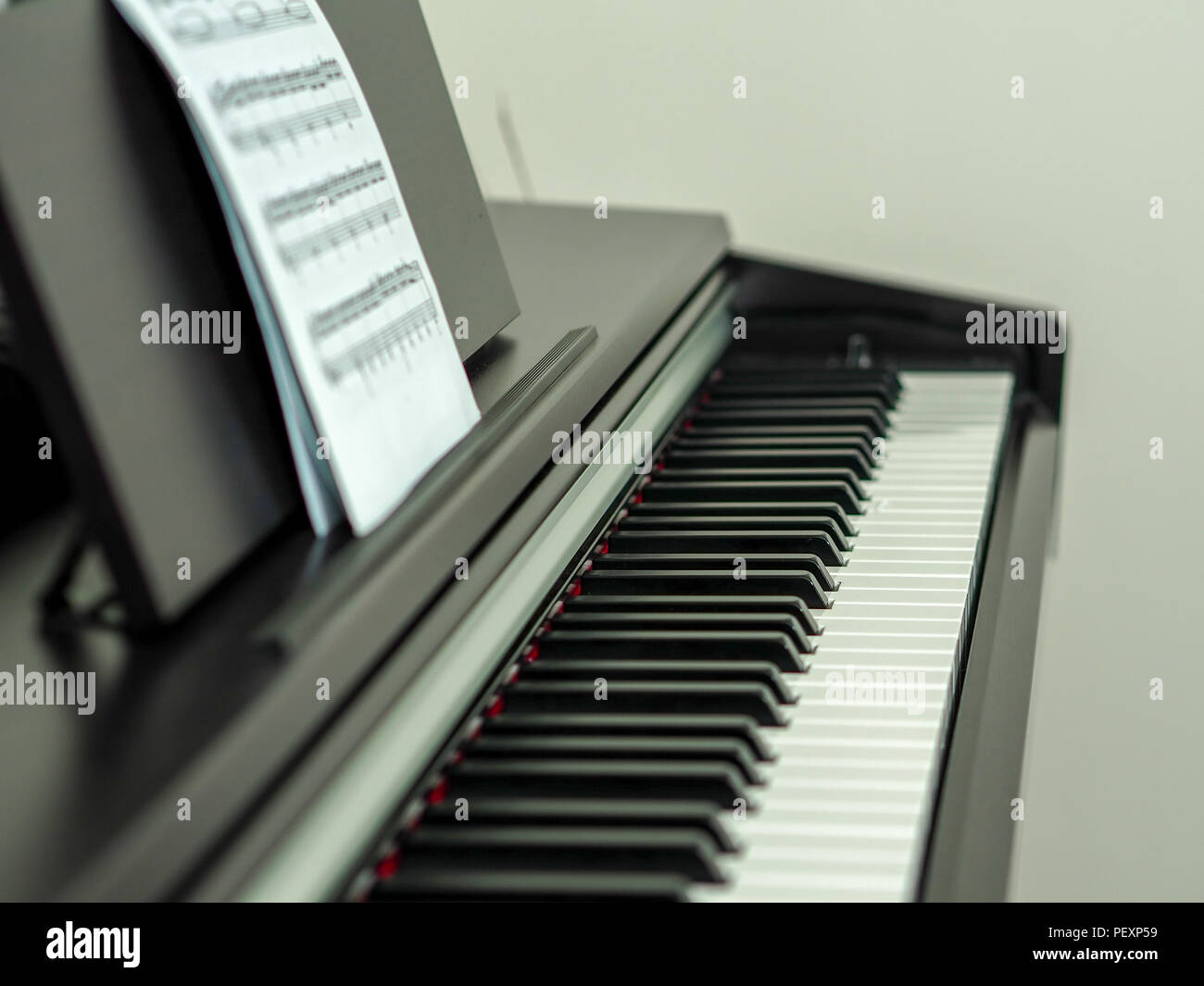 close-up black and white piano keys and musical notes Stock Photo - Alamy