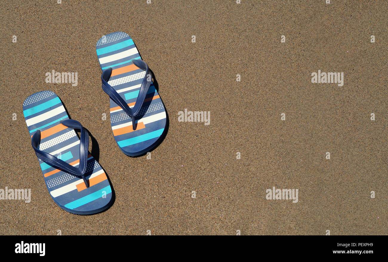 blue slippers on the beach on the sand Stock Photo - Alamy