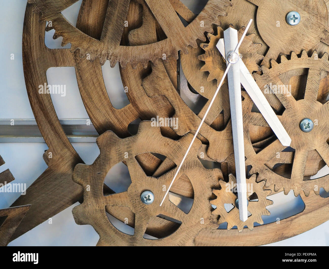 timber clock on the wall made of wheel Stock Photo Alamy