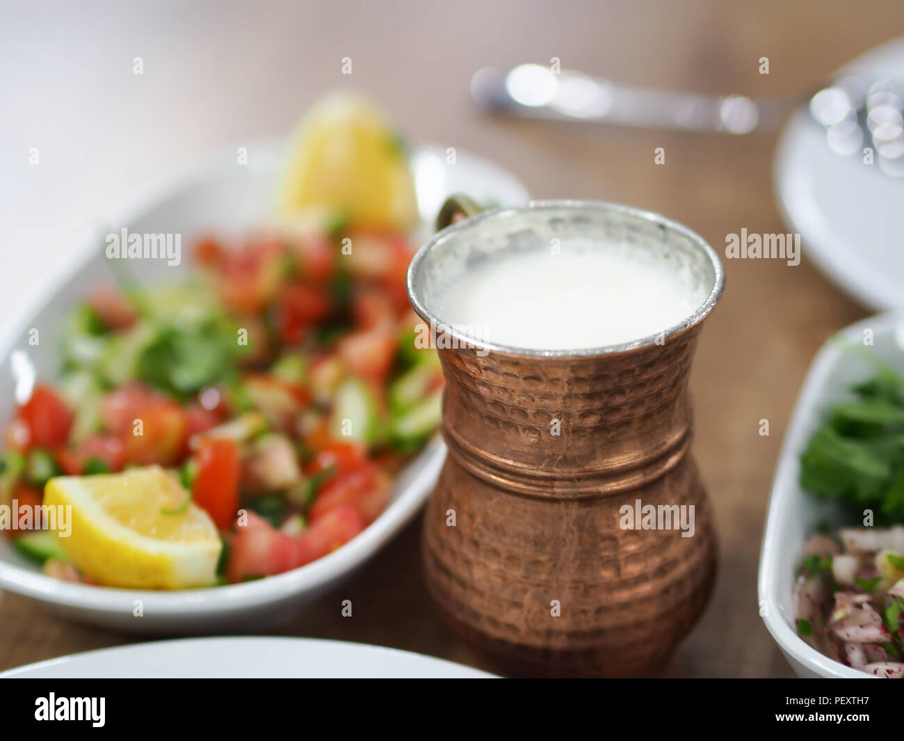 a cup of turkish ayran and turkish dinner table Stock Photo
