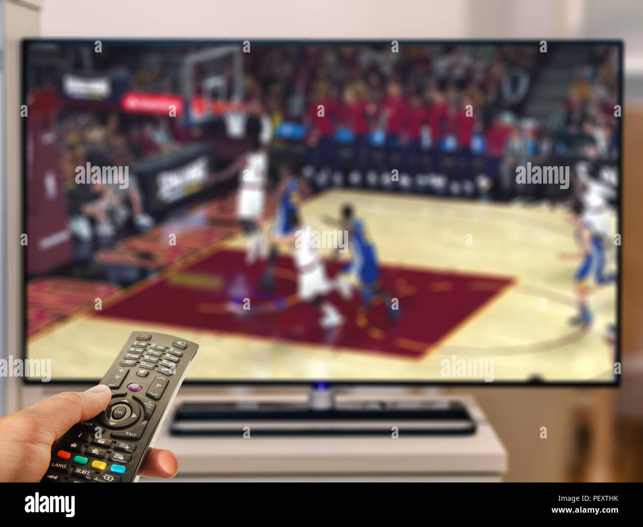watching basketball game on TV Stock Photo