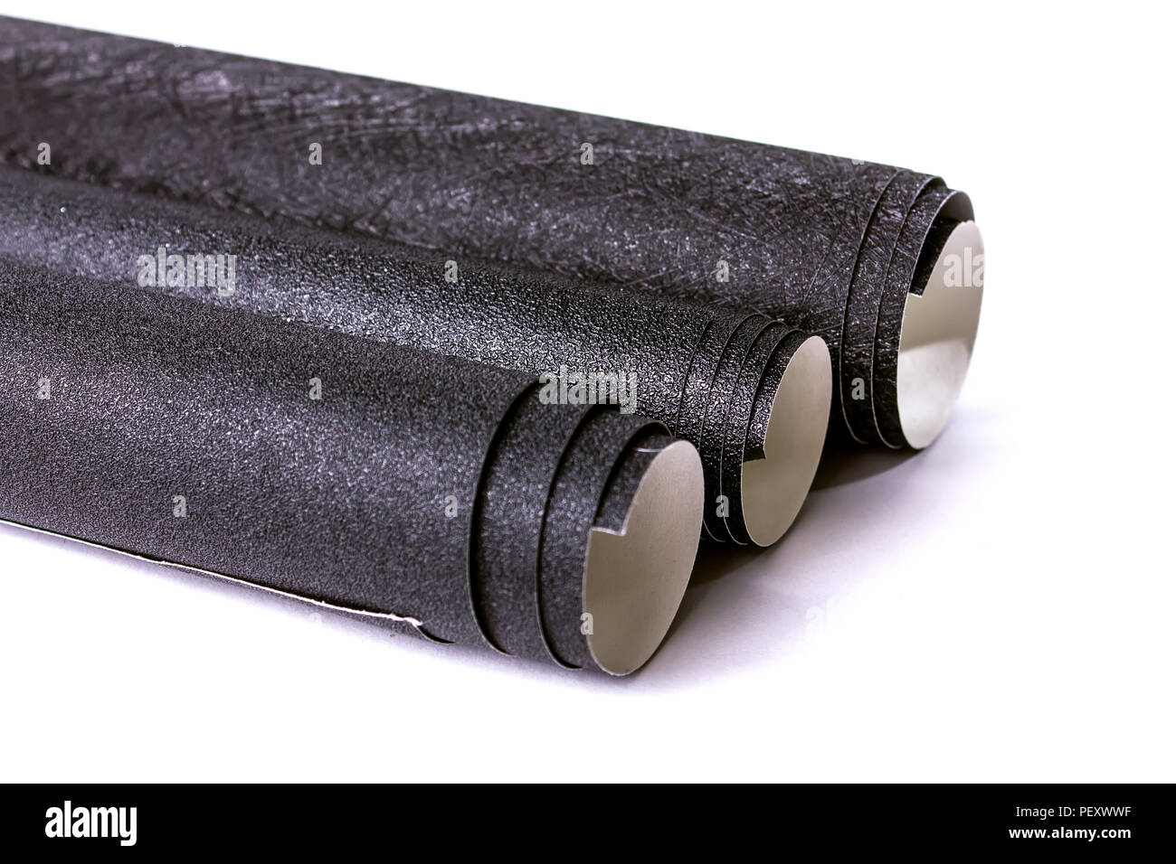 black wallpaper rolls on white background Stock Photo Alamy