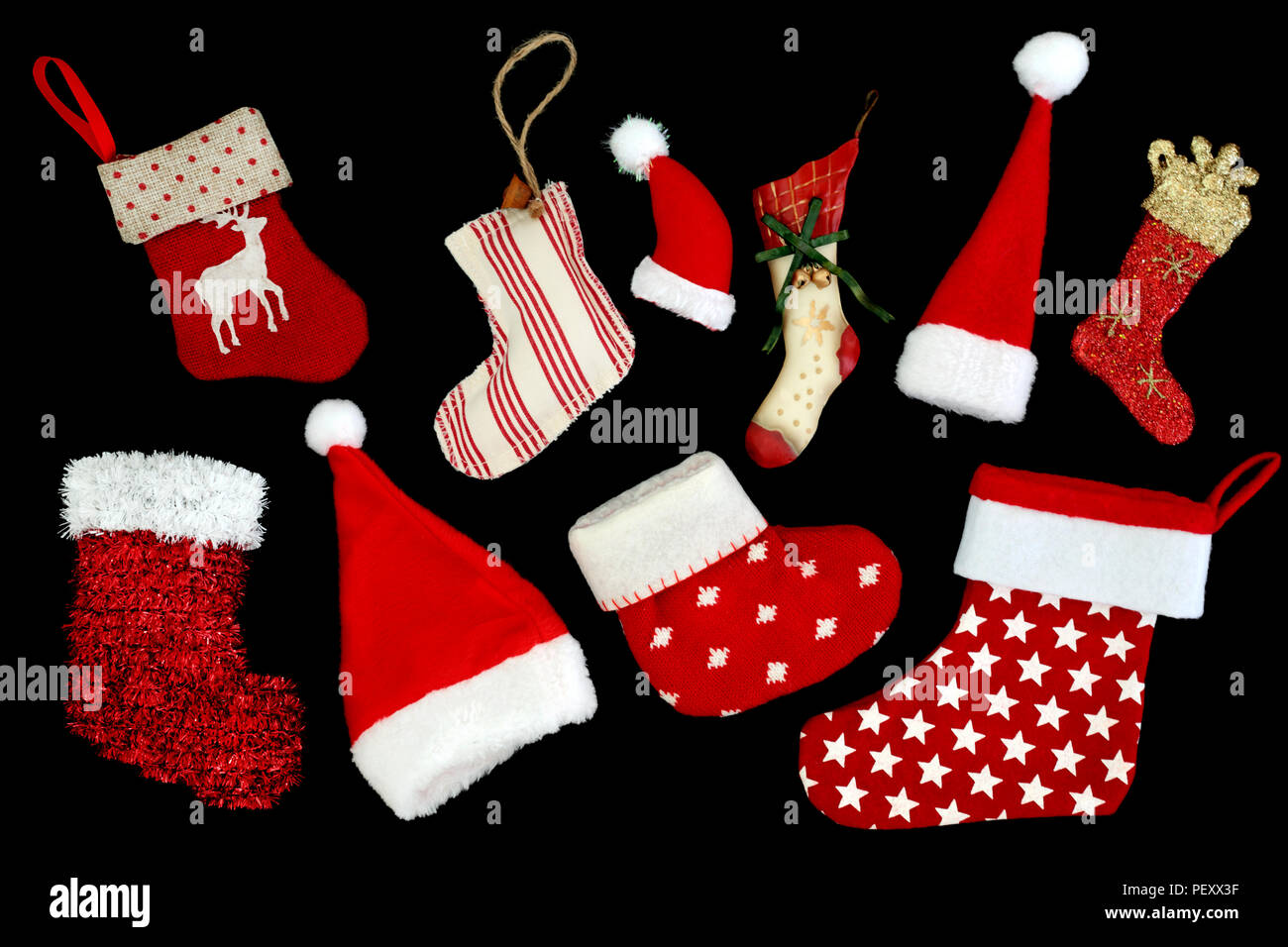 Christmas Stockings And Santa Hat Decorations On Black Background