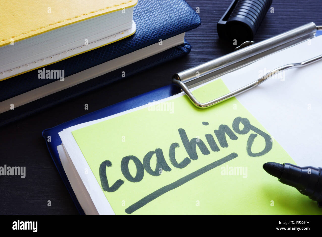 Coaching and mentoring concept. Clipboard with learning papers. Stock Photo
