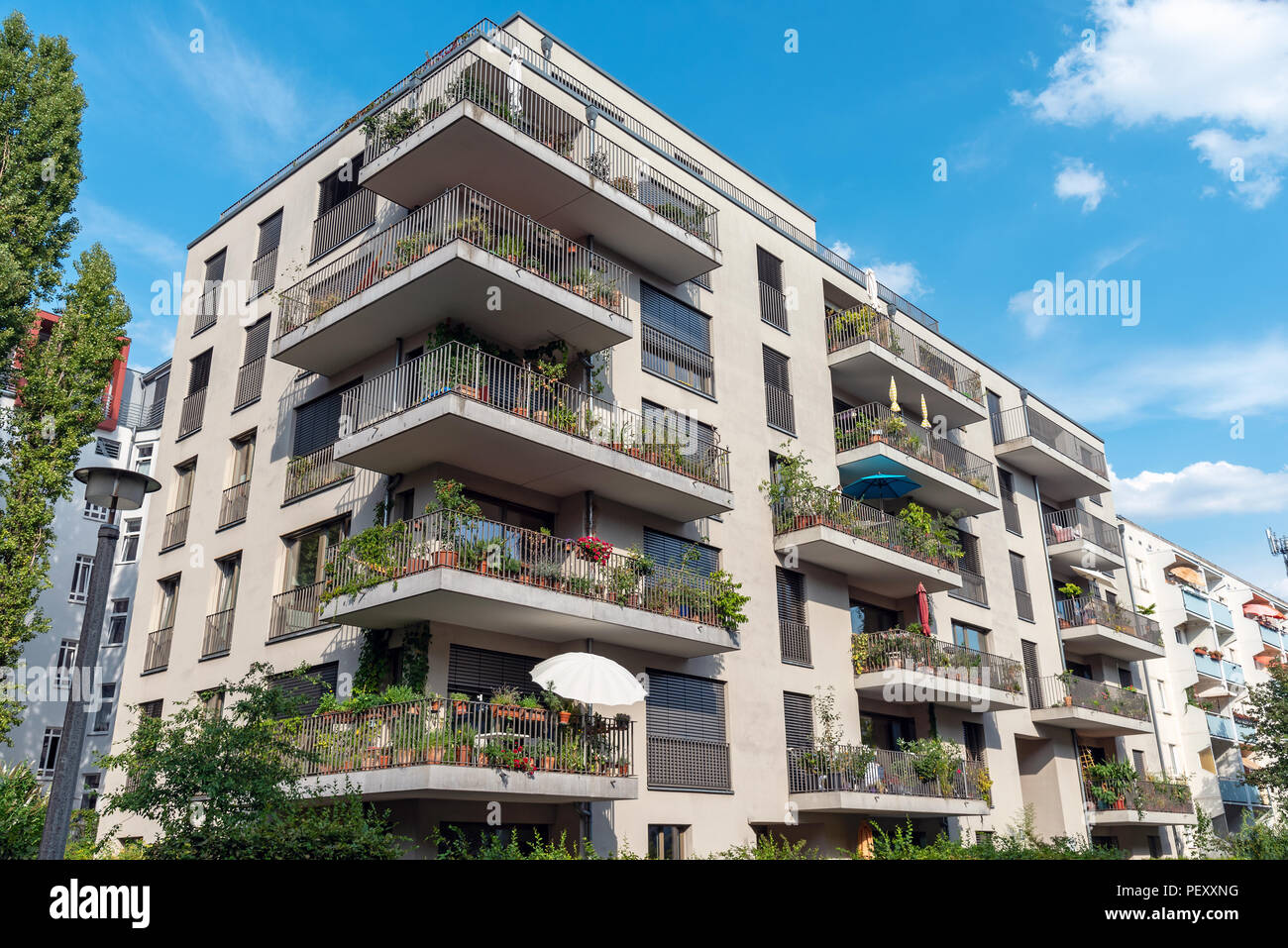 Modern grey apartment building with big balconies seen in Berlin, Germany Stock Photo
