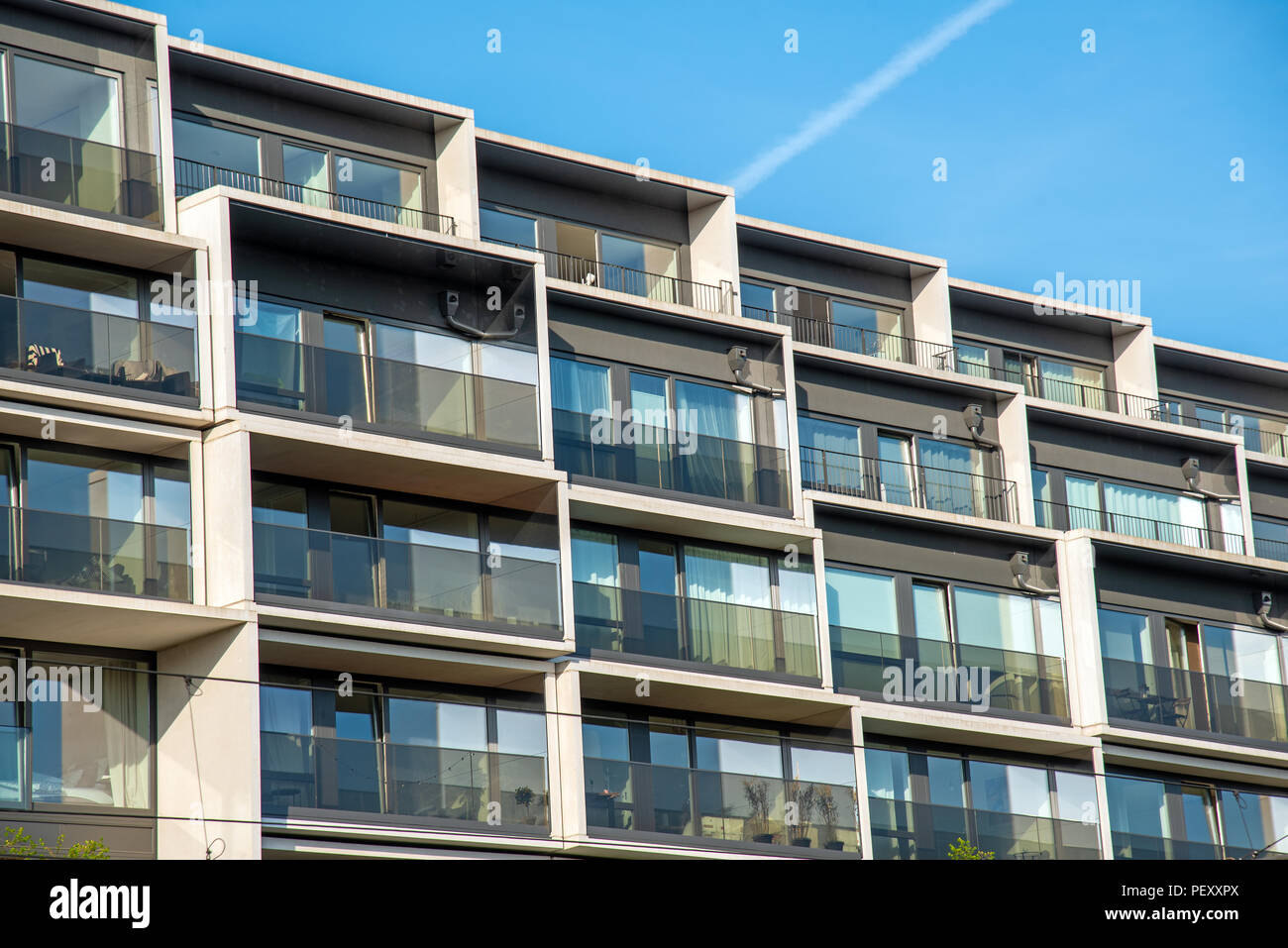 Facade of a modern housing construction with a lot of balconies seen in Berlin, Germany Stock Photo