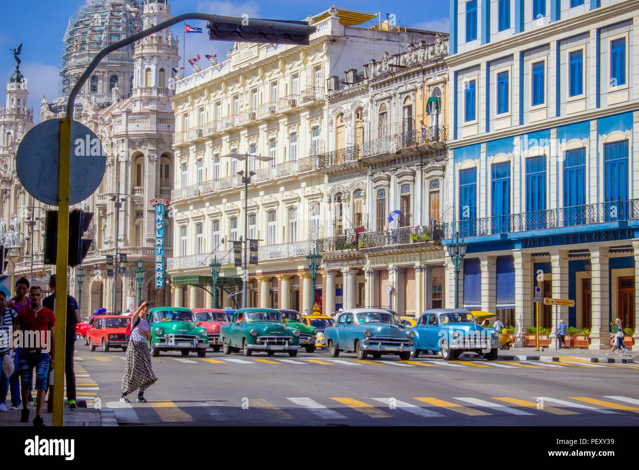 Colourful Street View of American Cars at road junction in Havana Stock Photo