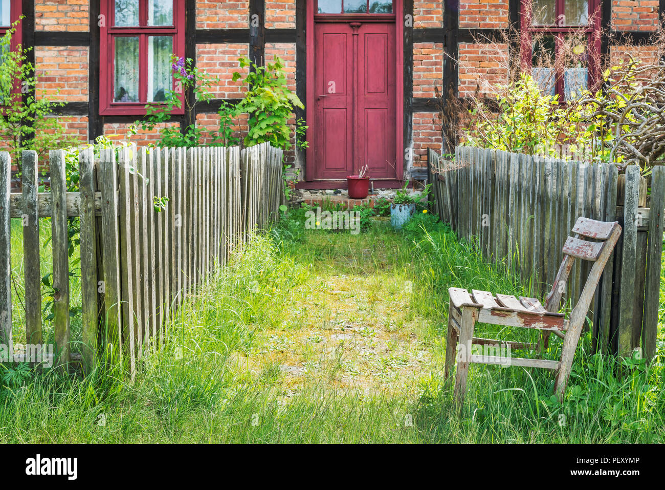 Old House In The Museum Village Baruther Glashuette At The Garden Fence Is An Old Wooden Chair Brandenburg Germany Stock Photo Alamy