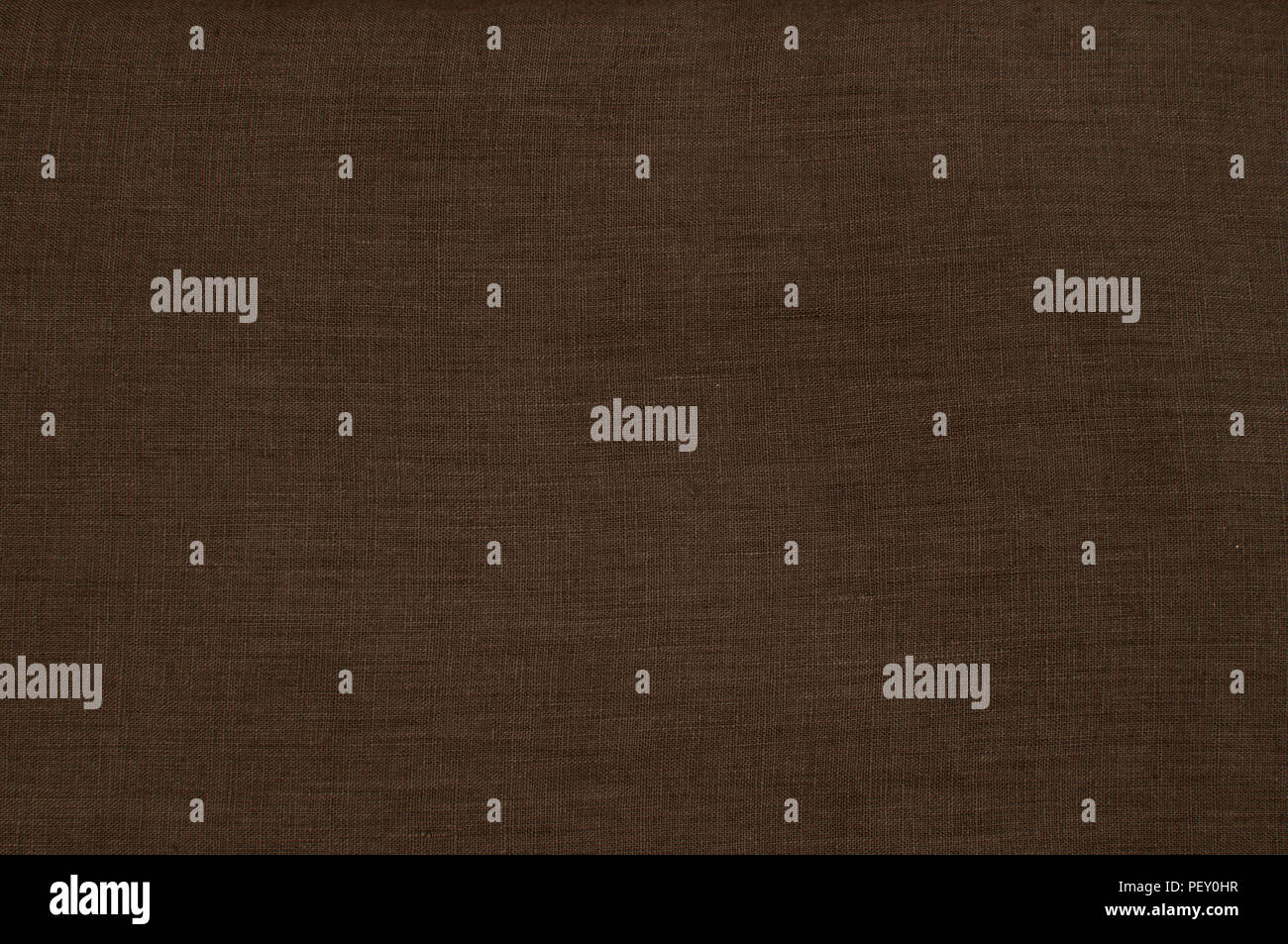 Dark brown linen fabric texture surface closeup as textile background
