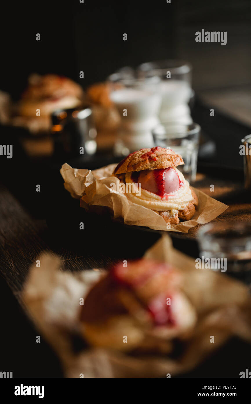 Food concept. Breakfast with coffee and shu dessert in cafe. Stock Photo