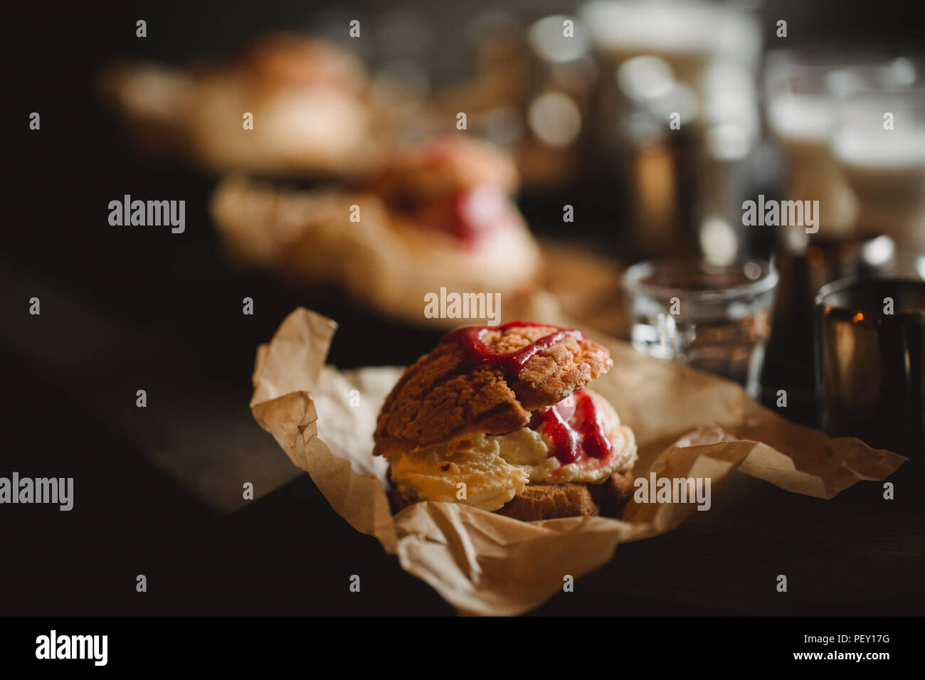 Food concept. Breakfast with coffee and shu dessert in cafe. Stock Photo