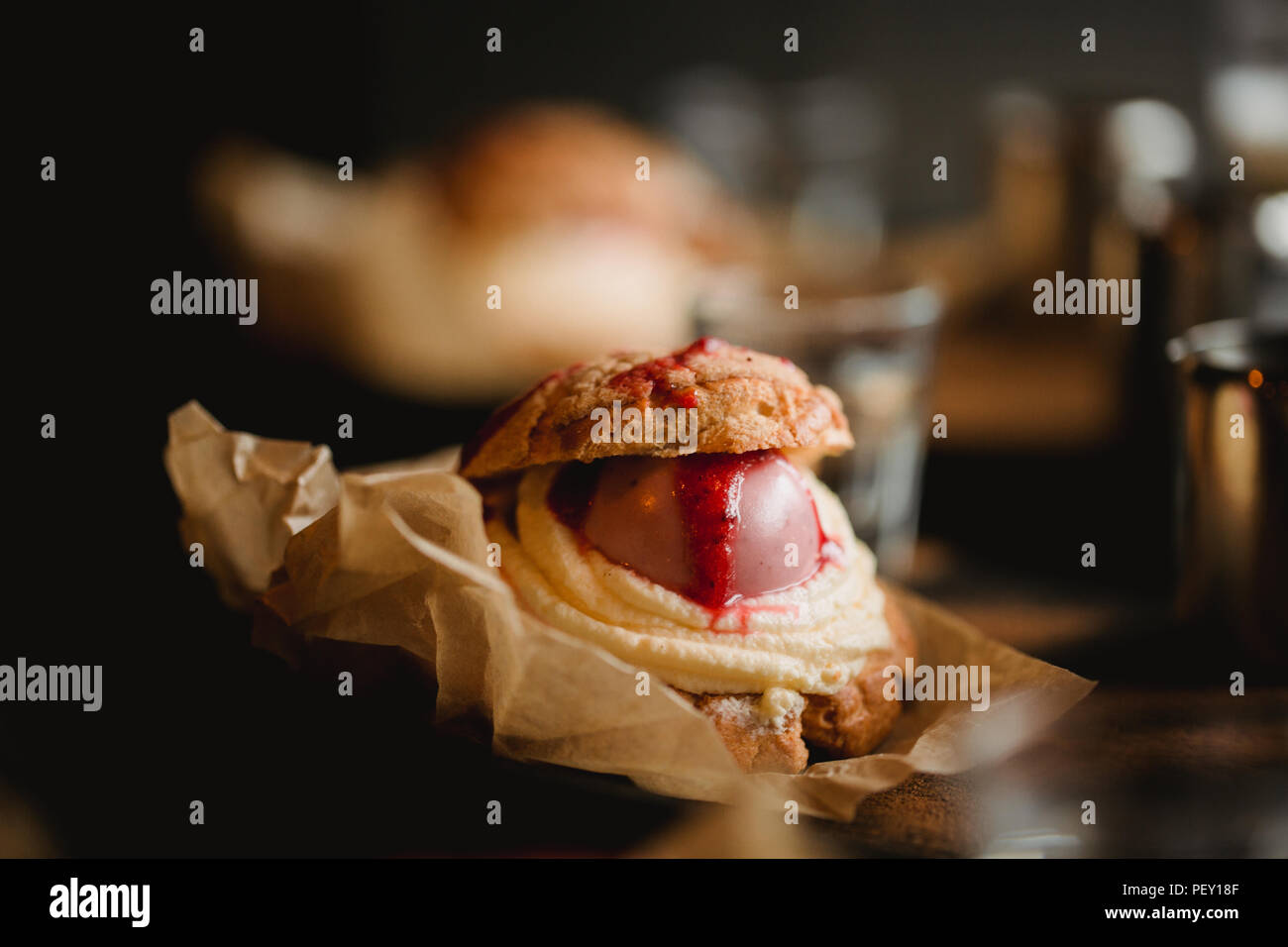 Food concept. Breakfast with coffee and shu dessert in cafe. Stock Photo