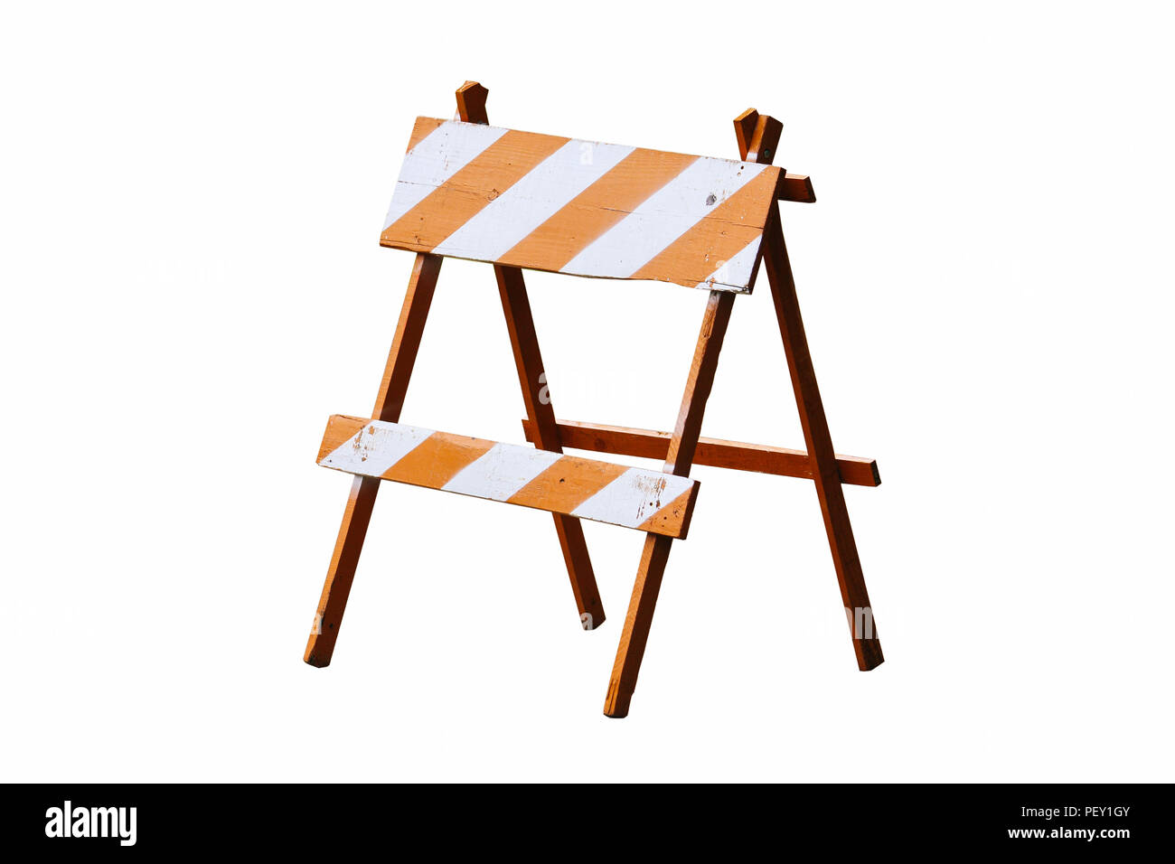 Orange and white painted vintage wooden road block or barrier as wood frame barricade with four legs isolated on a seamless white background. Stock Photo