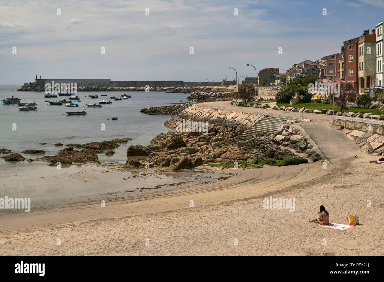 Woman in a bikini on the beach of Ribeira, La Guardia - A Guarda - Pontevedra province, Galicia region, Spain, Europe Stock Photo