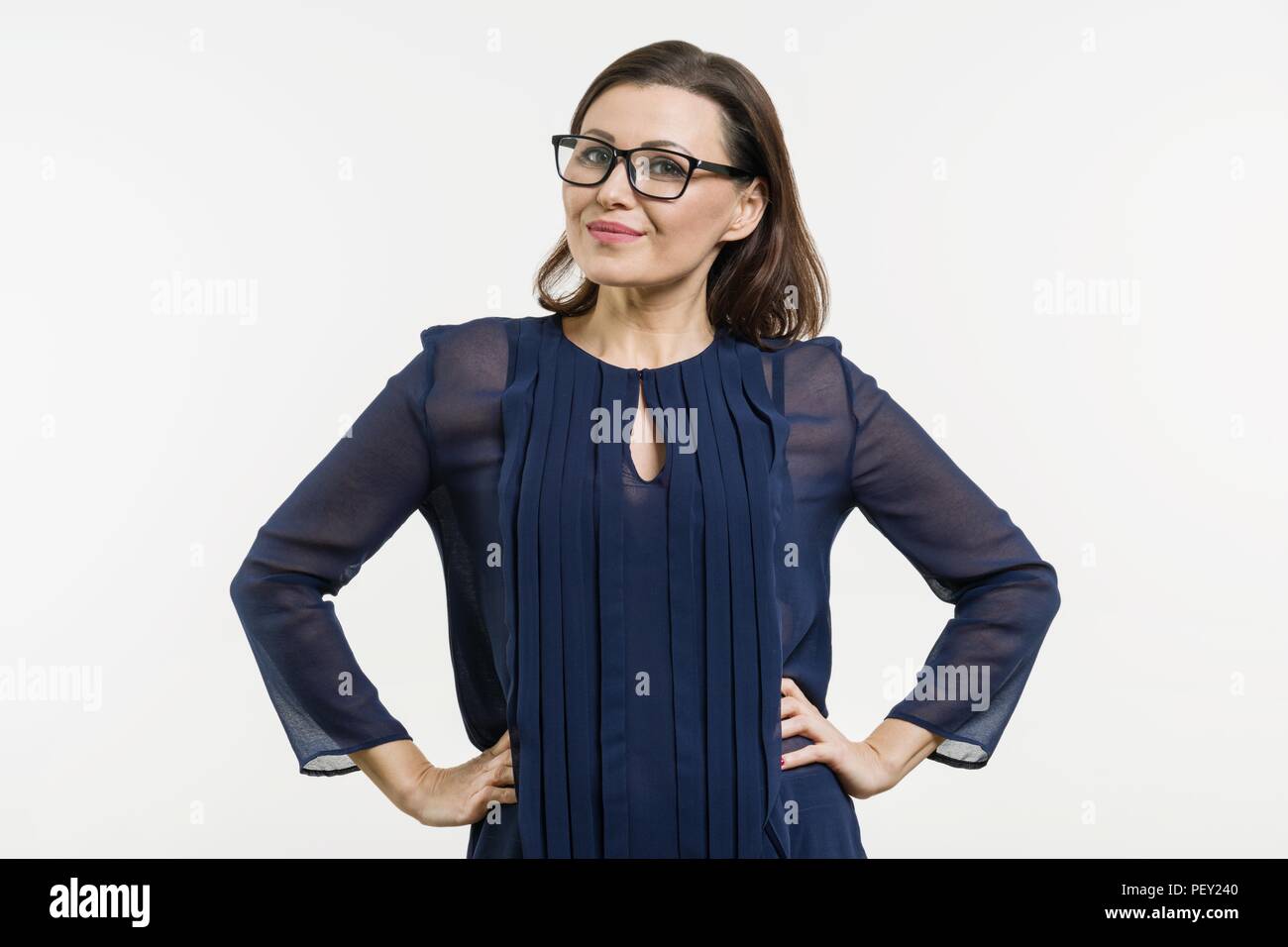 Mature positive woman standing hi-res stock photography and images - Alamy