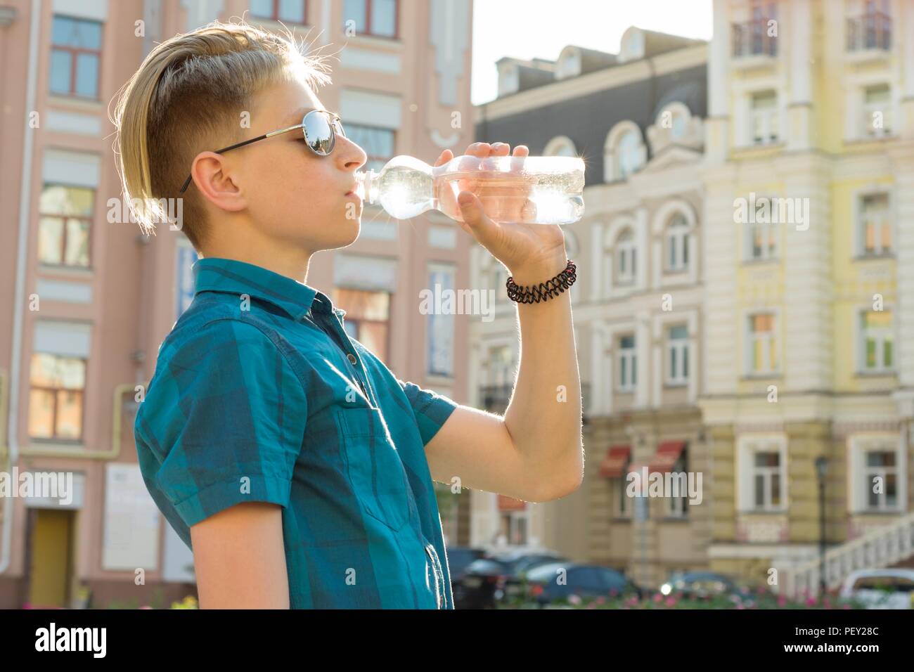 Teen boy drinking water hi-res stock photography and images - Alamy