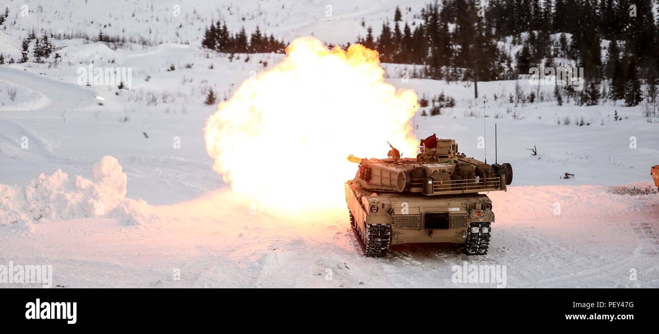 An M1A1 Abrams tank fires its main gun during a live-fire exercise in ...