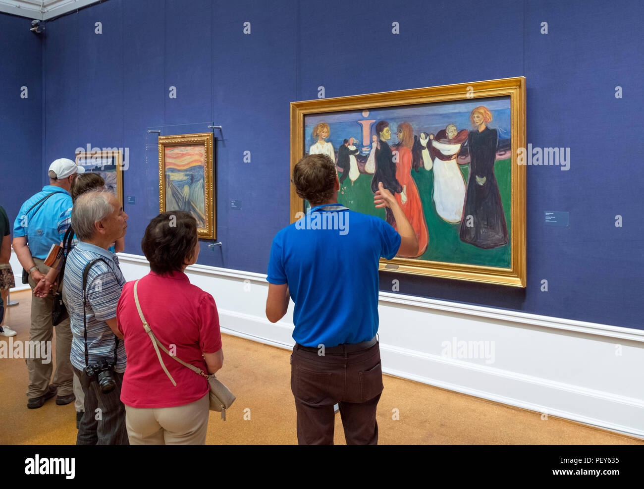 National Gallery, Oslo. Visitors looking at The Dance of Life (Livets dans), a painting by Edvard Munch, National Gallery, Oslo, Norway Stock Photo