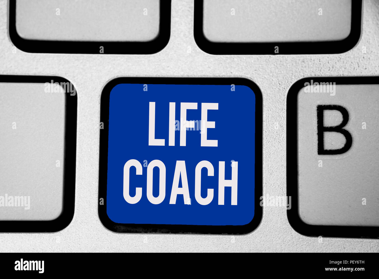 Word writing text Life Coach. Business concept for A person who advices clients how to solve their problems or goals Keyboard blue key Intention creat Stock Photo