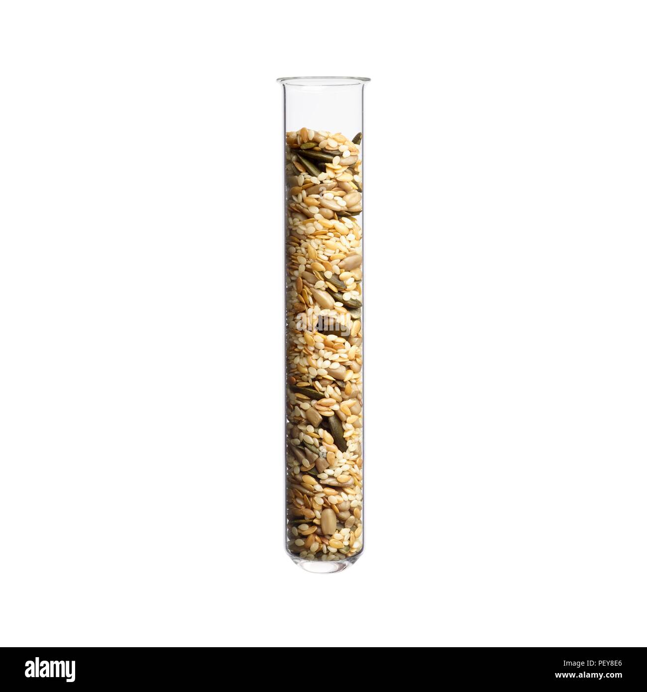 Mixed seeds in test tube, studio shot. Stock Photo