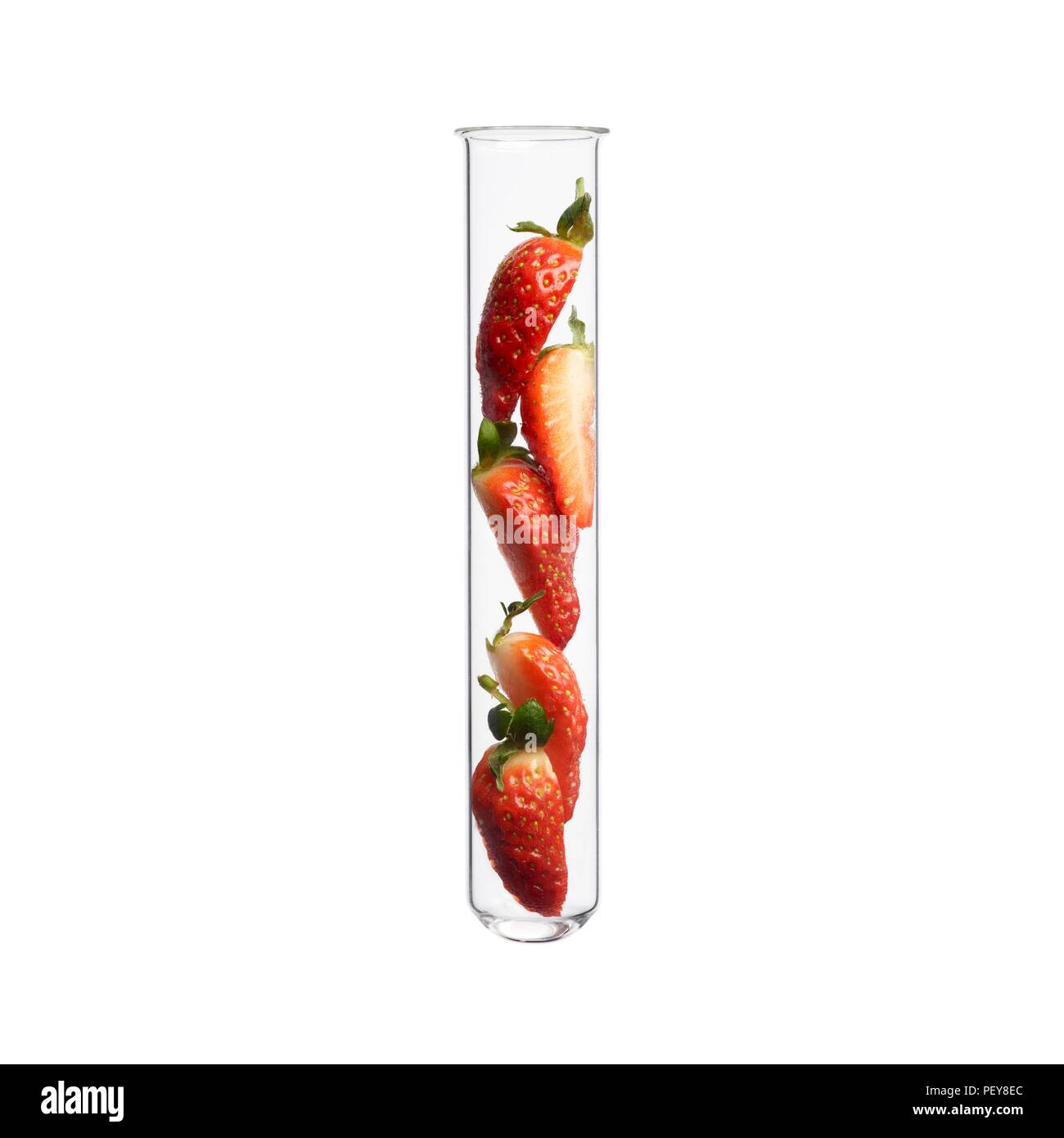 Sliced strawberries in test tube, studio shot. Stock Photo