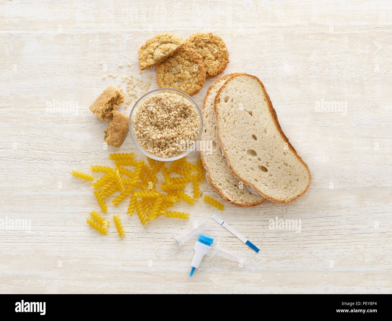 Bread and pasta with celiac test equipment, studio shot. Stock Photo