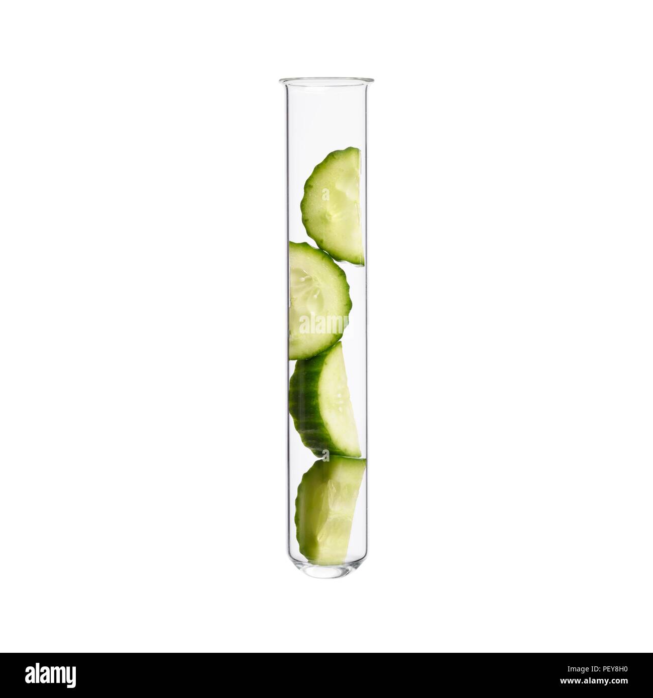 Cucumber in test tube, studio shot. Stock Photo