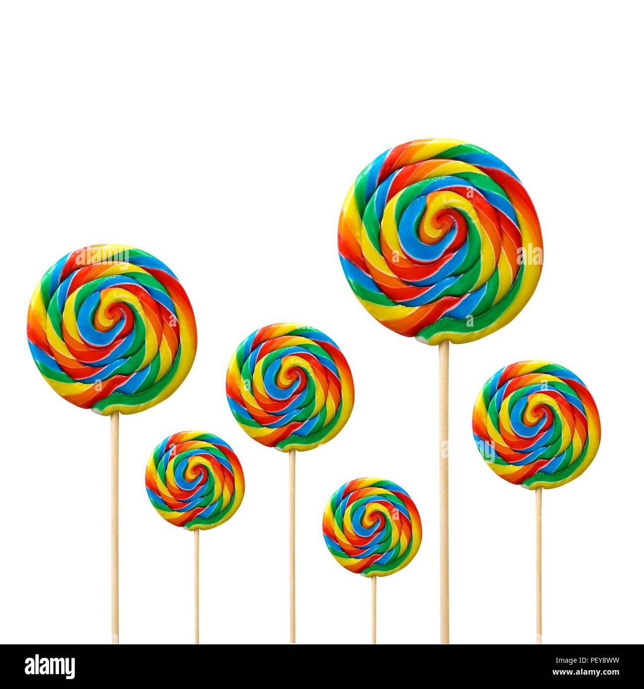 Bright coloured lollipops against a white background. Stock Photo