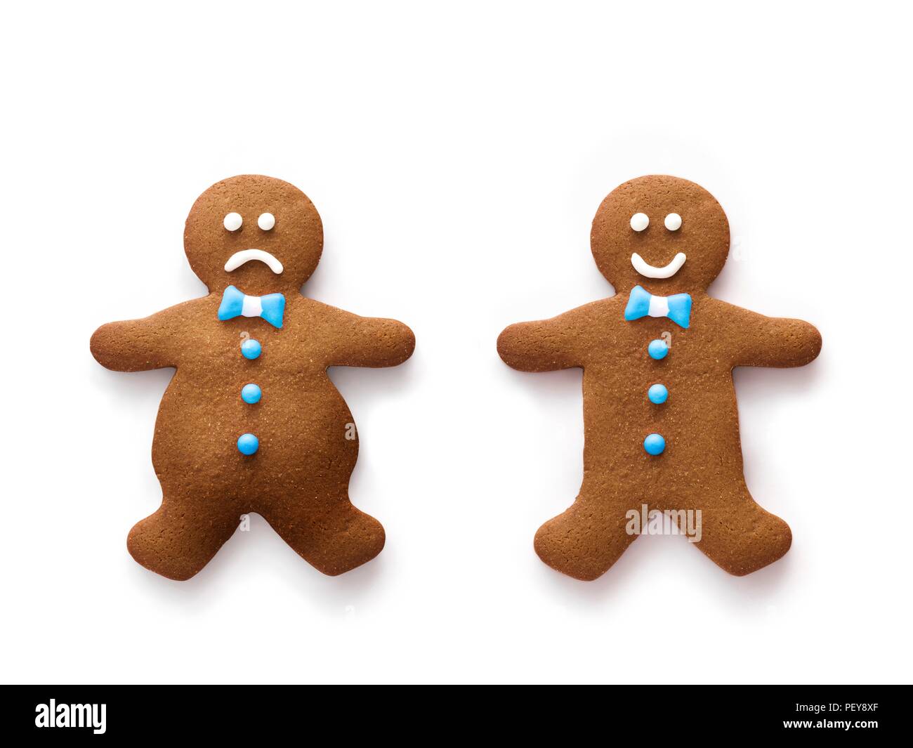 Obese and healthy weight gingerbread men. Stock Photo