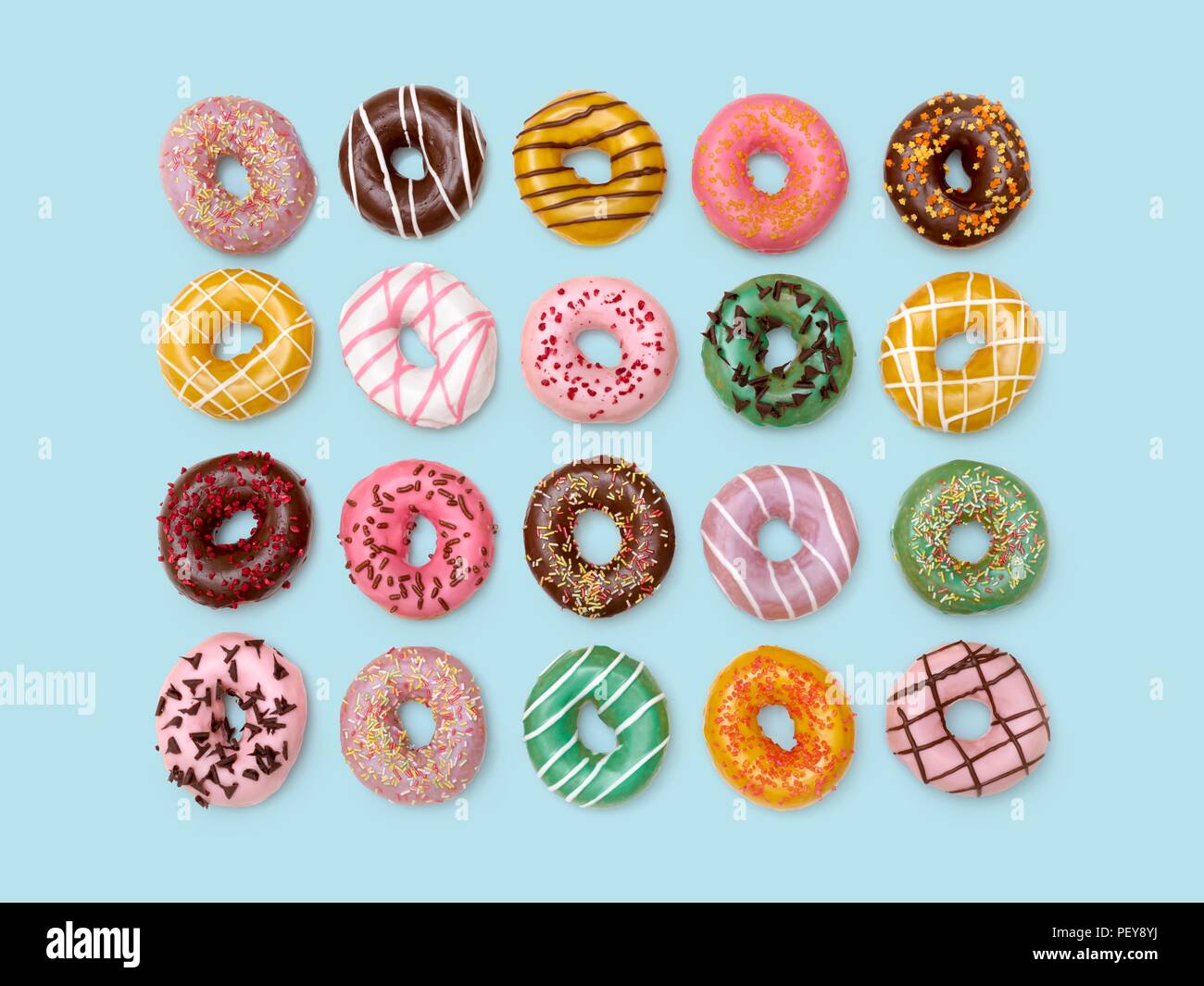 Colourful doughnuts, studio shot. Stock Photo