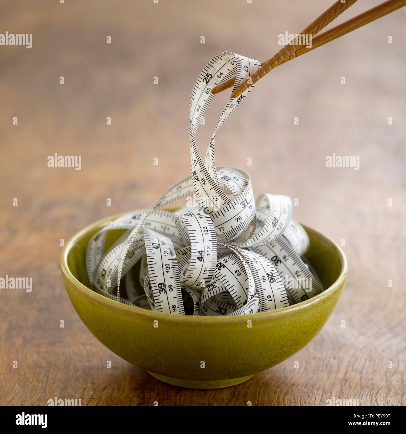 Chinese food bowl with tape measure. Stock Photo